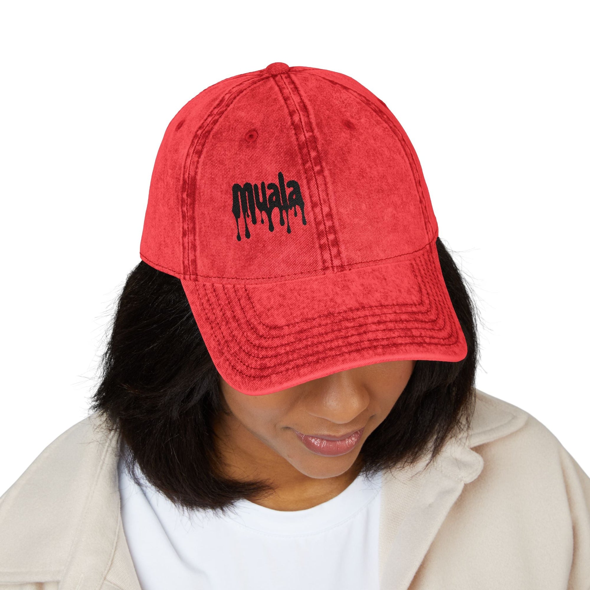 Red distressed Muala® "sunday pizza" cap with black embroidered logo on right front panel worn by person