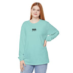 Woman wearing light blue muala long sleeve tee with drippy black logo on chest, made of 100% ring-spun cotton in classic fit.