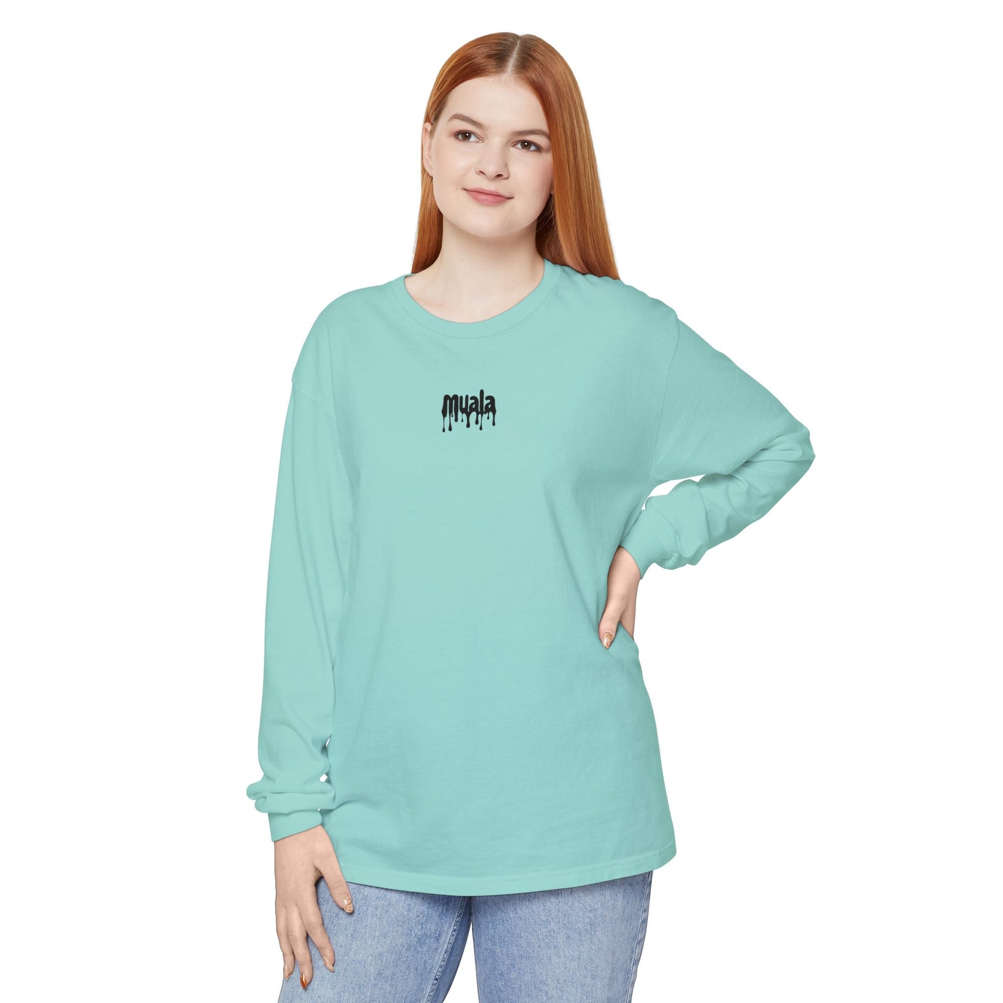 Woman wearing light blue muala long sleeve tee with drippy black logo on chest, made of 100% ring-spun cotton in classic fit.