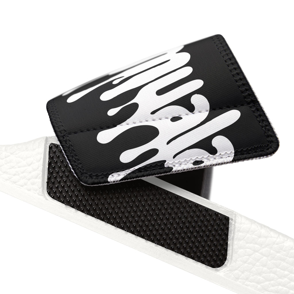 Close-up of removable black and white strap detail for Muala® flip fat flop men's sandals with embossed grip padding.