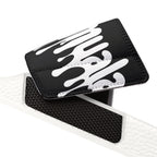 Close-up of removable black and white strap detail for Muala® flip fat flop men's sandals with embossed grip padding.