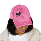 Woman wearing a distressed pink Muala® "sunday pizza" Cap with black embroidered logo on front panel, vintage style cotton twill baseball hat