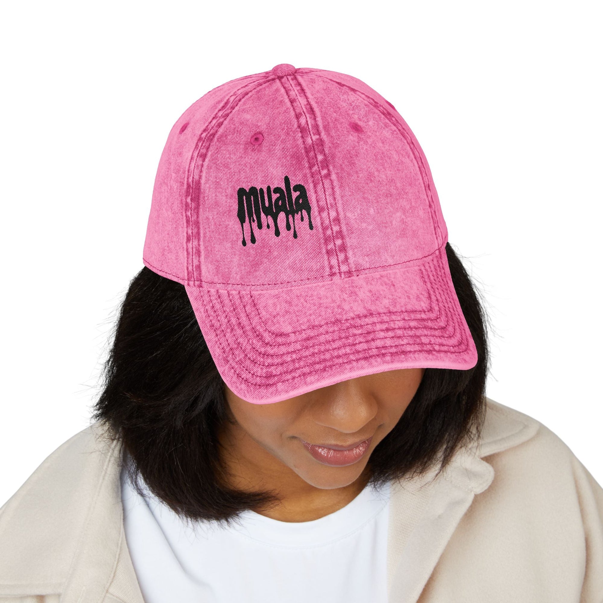 Woman wearing a distressed pink Muala® "sunday pizza" Cap with black embroidered logo on front panel, vintage style cotton twill baseball hat