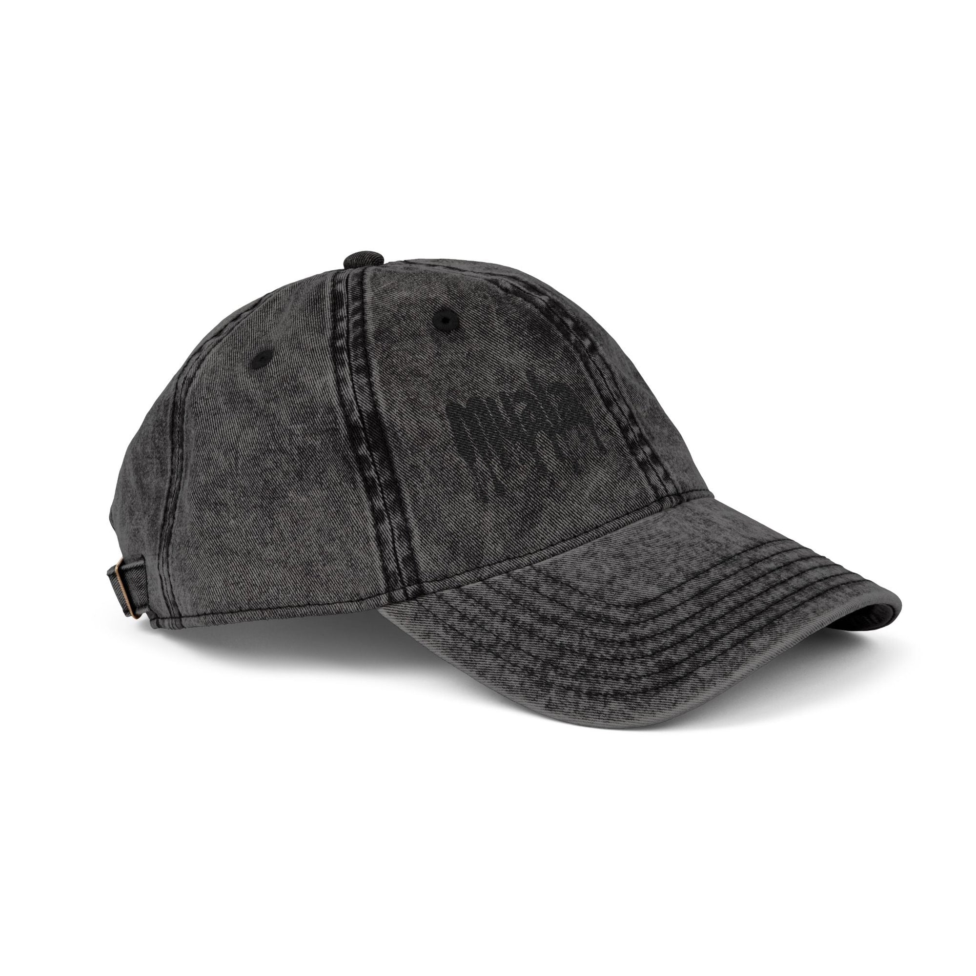 Black distressed Muala® "sunday pizza" cap with black embroidered logo on right front panel and adjustable antique brass buckle.