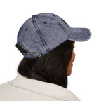 Side view of a person wearing distressed navy blue Muala® "sunday pizza" cap with black embroidered logo on the right front panel and adjustable antique brass metal buckle at the back