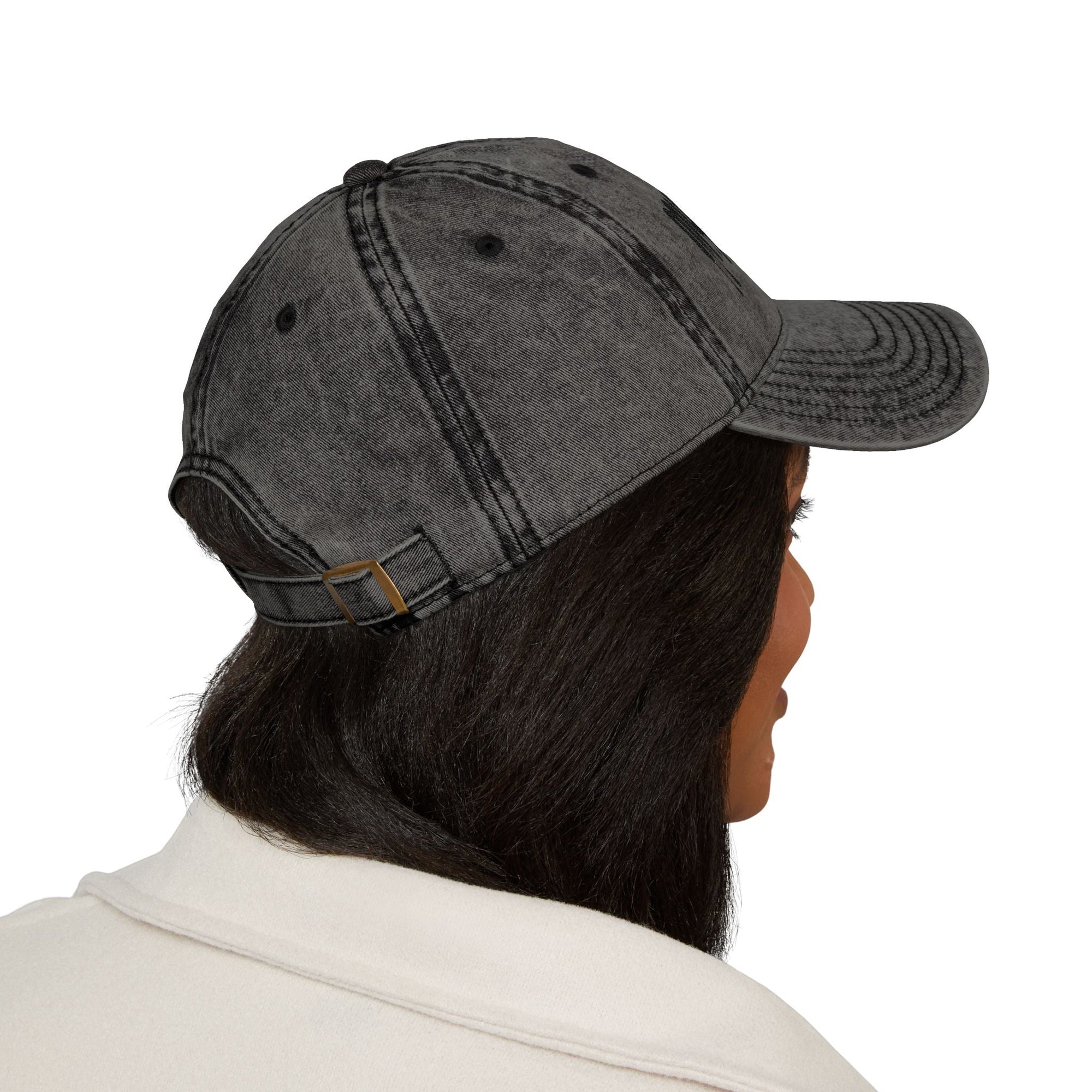 Vintage distressed black Muala® "sunday pizza" cap with embroidered logo and adjustable strap worn from the back