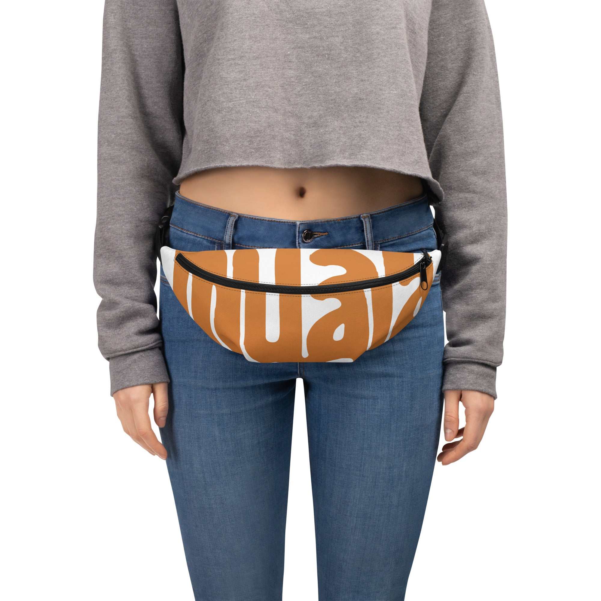 woman wearing muala® "fant pack" daily brown and white water-resistant fanny pack with adjustable straps for hands-free carry