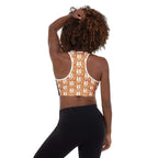 Back view of a woman wearing muala® "workout fuel" sports bra with exclusive Pattern Vol.1 graphics and racerback design.