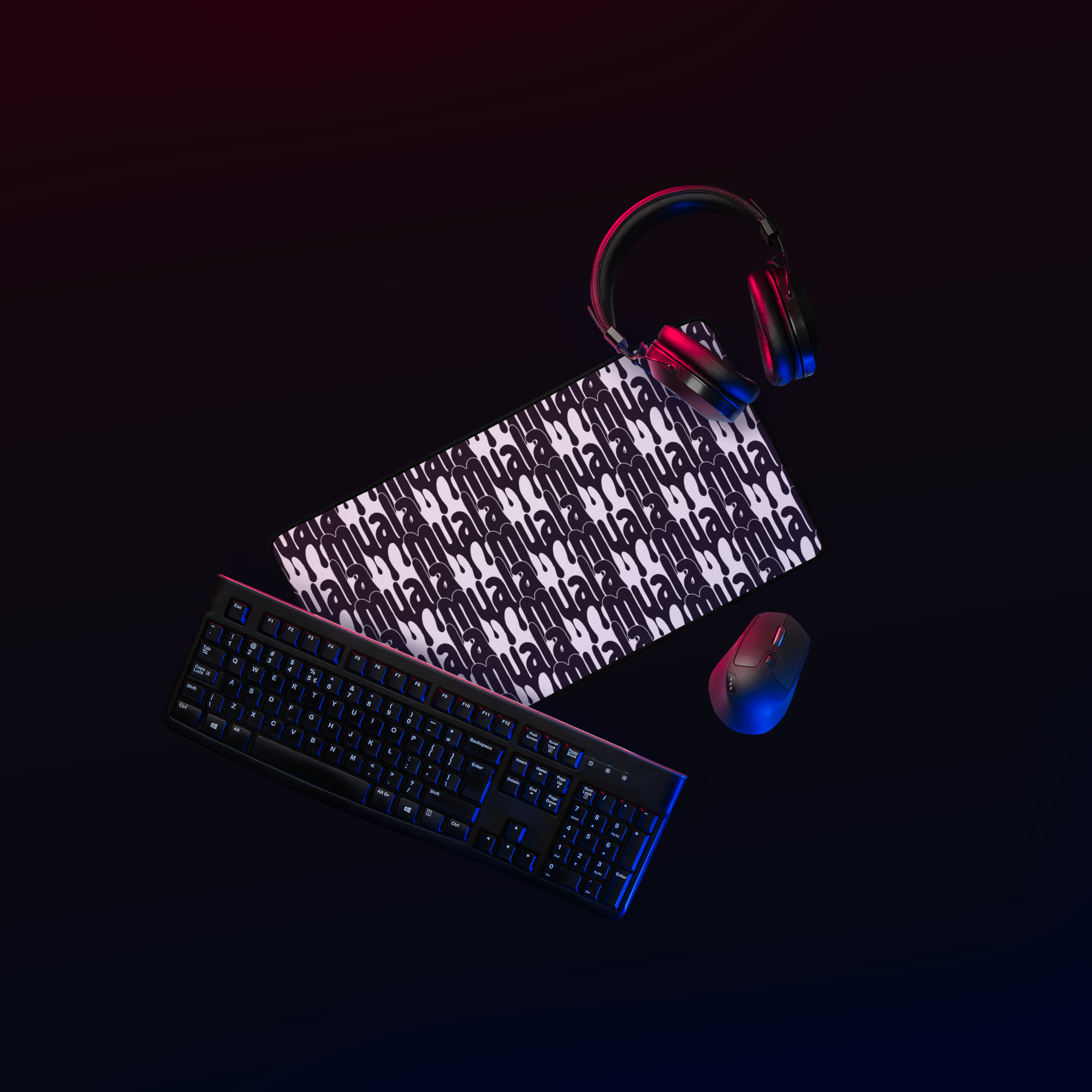 Muala desk mat with Pattern Vol.1 streetfoodwear graphics, polyester top, natural rubber base, shown with keyboard, mouse, and headphones.