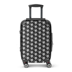 Black and white muala® travel wrap suitcase with embossed pattern vol. 1 design, hard-shell polycarbonate and ABS construction, four 360-degree swivel wheels, and telescopic handle.