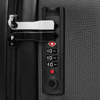 Close-up of TSA-friendly built-in combination lock on black polycarbonate travel wrap suitcase